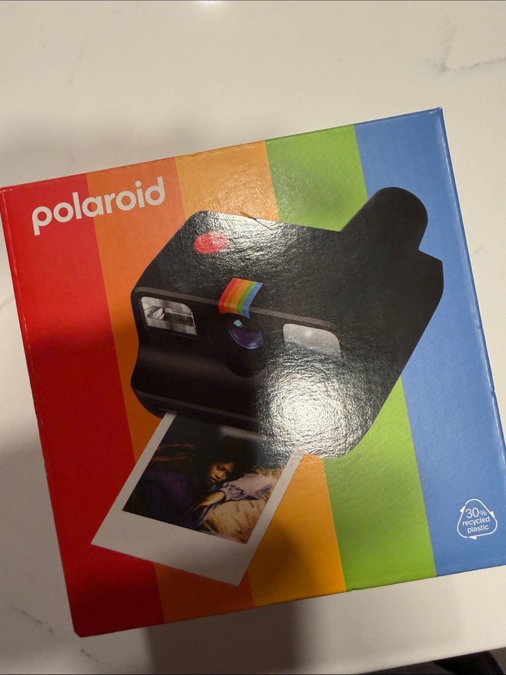 Polaroid Black Camera Graphic Box with Red, Orange, Yellow, Green, Blue Stripes